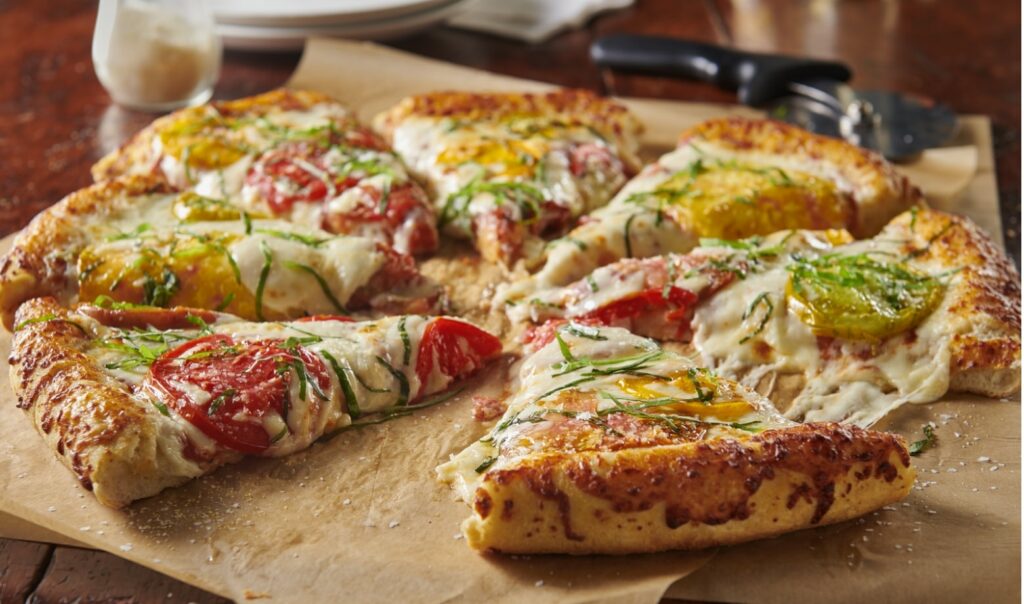 sliced pizza on a serving tray