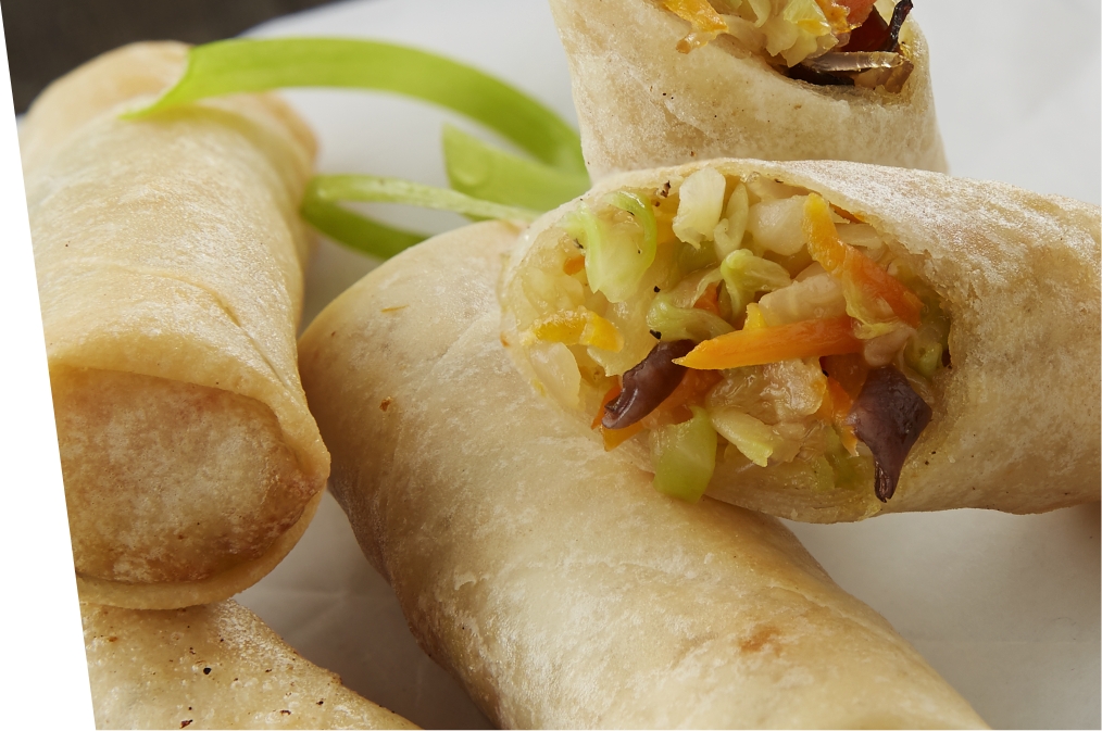 egg rolls sliced open on a plate