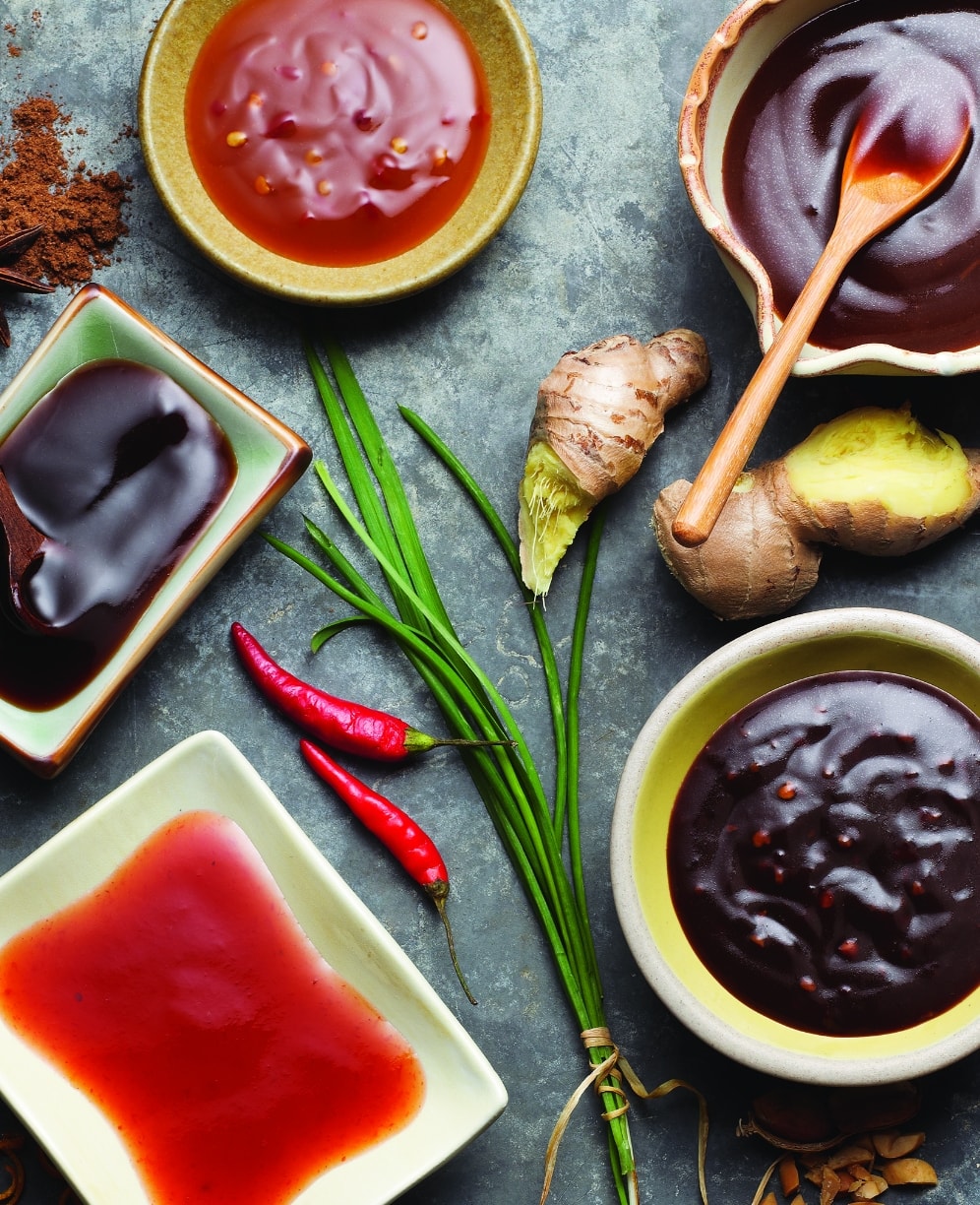 a variety of Asian-cuisine inspired sauces in bowls