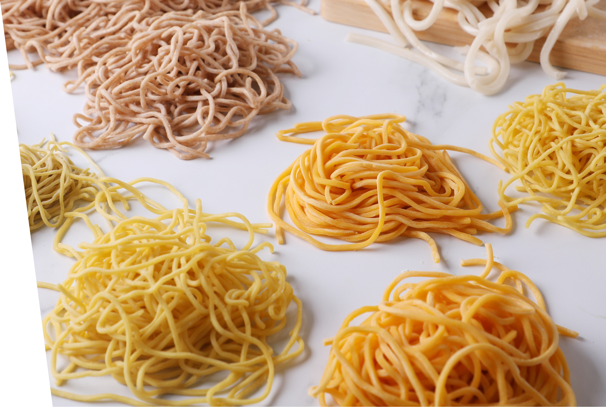 group of different Asian noodles on a marble surface