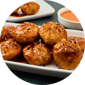 korean chicken and vegetable steamed dumplings with gochujang