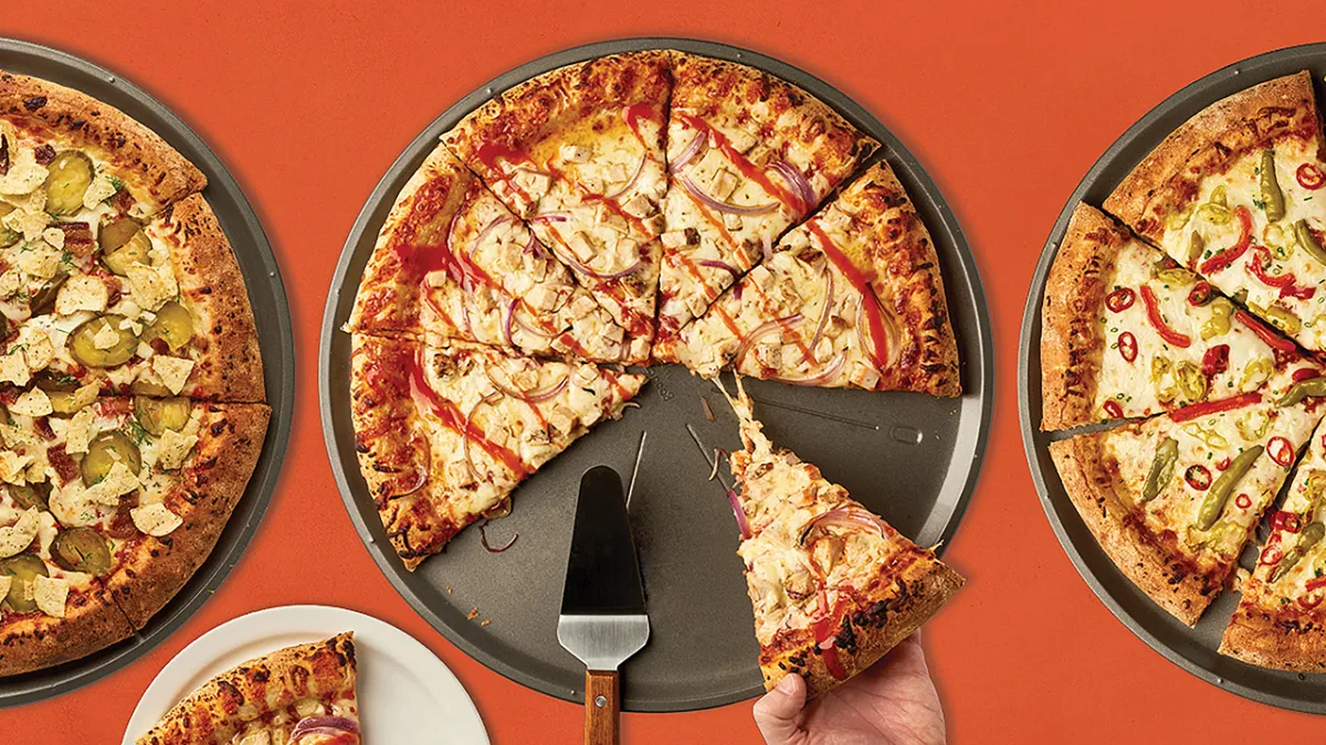 Whole, sliced Villa Prima Hot Honey Pepper Pickle Pizza on a pizza tray.