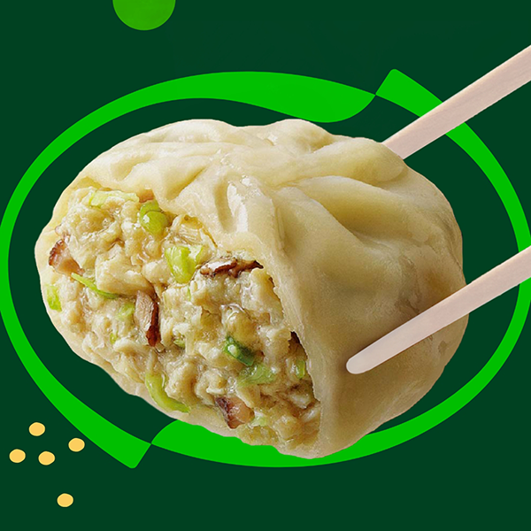 Chopsticks holding a single bibigo™ steamed dumpling.